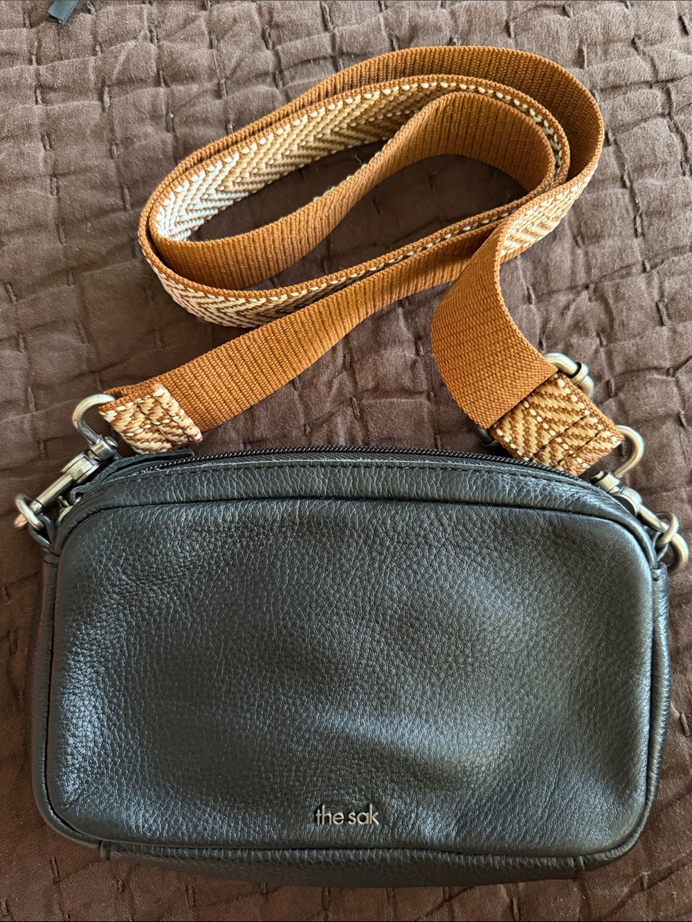 The Sak Cora Black Pebbled Leather Crossbody with Tan Woven Strap